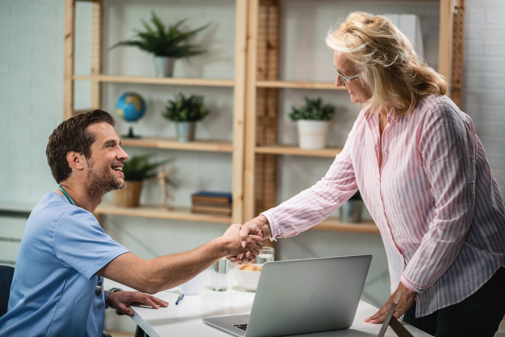 Provider shakes hands with a patient.